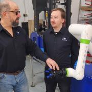 Vita-Nova Solutions’ director Paul Millard with design director and son Keanu and one of their automation services products