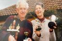 Pamela Newton (right) with husband John and some of the bowls trophies they won in the UK.