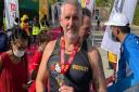 Andi Woolley is flying the Three Counties Running Club high as he competed in an Ironman event in Bahrain.