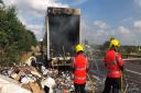 Fire crews clearing up after the lorry fire at Milton on the A14