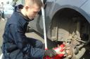 A Meadowgate School student carrying out work experience at the motor vehicle workshop