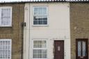 42 New Road Chatteris, a grade II listed building, owned by Peter Taylor who is fighting an oder to change the windows back to wood.