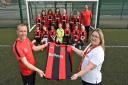 Bellway sponsor new football kit for Cotttenham football team. Bellways Heather Markham (right) with Cottenham Colts Under 12s team and their coaches, David Burkett (left) and Simon Rose. Picture: BELLWAY