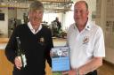 St Ives captain Jon Vallis (R) presented March captain Gareth Clark (L) with a copy of the book written to celebrate 100 years of golf at St Ives.