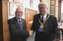 Outgoing Fenland District Council Chairman Cllr Alex Miscandlon, left, with incoming Chair Cllr Nick Meekins
