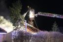 Firefighters at the scene of the bungalow fire in Hundred Road, March, last night (Thursday January 4).
