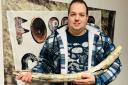 Jamie Jordan with the mammoth tusk found near Peterborough.