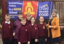 Pupils at Gorefield Primary Academy were praised for their behaviour by Ofsted inspectors, who rated the school as \'good\'. Some of the pupils are pictured with executive headteacher Ruth Bailey.