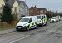Police and forensic unit teams in Wimblington Road, Doddington, this morning.