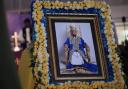 A portrait of Tooro’s King Oyo Nyimba is displayed inside St John’s Cathedral in Fort Portal (Patrick Onen/AP)