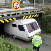 Caravan misjudges height and gets wedged under Stonea bridge