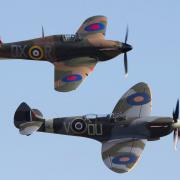 A Spitfire (front) and a Hurricane (back) fly in tandem.