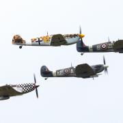 A vintage four of two Spitfires, a Mustang and a Buchon flying in formation at IWM Duxford.