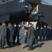 Queen Elizabeth, the future Queen Mother, inspecting Lancaster bomber crews on a visit to RAF Warboys.