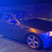 A BMW driver travelling at 127mph on the A1M in Cambridgeshire was caught and charged after he overtook a marked police car.