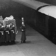 King George VI's coffin being taken from the ten-coach funeral train. Large crowds had gathered in Ely to pay their respects.
