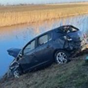 Two people escaped unharmed after a car crashed into the Sixteen Foot Bank at Stonea.