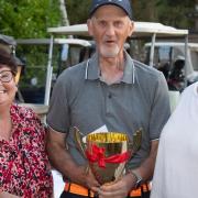 Frank Howard (centre) with the winners' trophy alongside John Gamble's wife Jill and his daughter Katie.