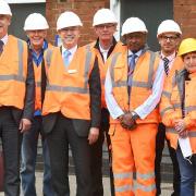 MP Steve Barclay (left) and Cllr Jan French, deputy leader of Fenland Council (third right) look at progress on a major redevelopment of March rail station.