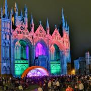 The magnificent west front of Peterborough Cathedral is lit by a new state-of-the-art LED lighting system for the first time