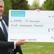 MP Steve Barclay with a £500 cheque from Anglian Water which has supported his Read to Succeed campaign.