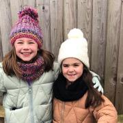Nine-year-old Polly Anderson and her seven-year-old sister Robyn Symons are gearing up to scoot 30 miles to raise cash for The Queen Elizabeth Hospital in King’s Lynn.