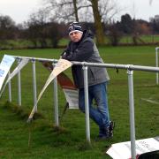 Edwin Fey, chairman of March Bears RUFC, with sponsorship boards that have been vandalised at the ground.