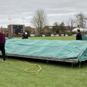 Stuart Arnold, Francis Gaimster, Nathan Oliver and Lewis Welcher putting the plastic sheets onto the covers.