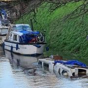 This sunken boat was left submerged in the River Nene at March over the Christmas break.