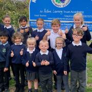 Pupils celebrating outside Kingsfield Primary School, in Chatteris, after it was awarded \'good\' in a recent Ofsted inspection.