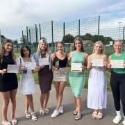 Phoebe Moore, Irene Long, Olivia Pacey, Jess Lloyd, Annabelle White, Gabby Betts, Ellie Shepherd celebrate GCSE results at Cromwell Community College