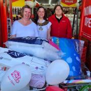 A charity trolley dash in aid of March Foodbank raised £248.  Pictured are foodbank manager manager Becky Cooper, Mayor of March Councillor Kim French and a member of staff at the new Poundstretcher store.