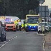 Police and ambulance crews at the scene of the crash in Oilmills Road, Pondersbridge