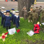 Knitted soldiers, sailors and airmen stood at a war memorial for 2022's Remembrance Sunday service