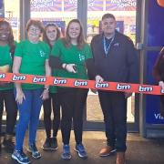 Chatteris Foodbank volunteers cut the ribbon at the new B&M store in Chatteris