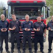 The firefighters with their Coronation Medals.