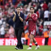 Liverpool manager Andoni Iraola and Milos Kerkez applaud the Liverpool fans (Peter Byrne/PA)
