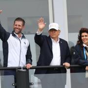 US President Donald Trump with his son Eric Trump waving to spectators at the Irish Open at the Trump International Golf Links & Hotel in Doonbeg, Co Clare (Damien Eagers/PA)
