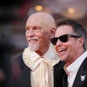 John Malkovich and Sam Rockwell pose for photographers on the red carpet in Venice earlier in September (Alessandra Tarantino/Invision/AP)
