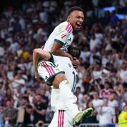 Real Madrid’s Alvaro Carreras, bottom, is congratulated by Kylian Mbappe (Manu Fernandez/AP)