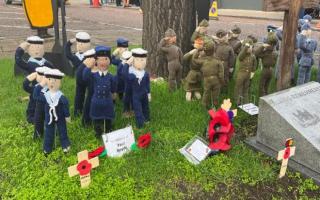 Knitted soldiers, sailors and airmen stood at a war memorial for 2022's Remembrance Sunday service